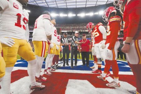 Lunas take to field for Super Bowl coin toss